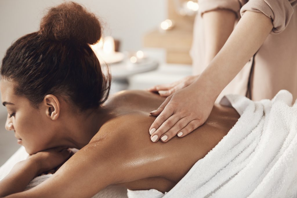 Massage Treatments 10 attractive african woman having massage relaxing spa salon closed eyes - LondonMassage4U