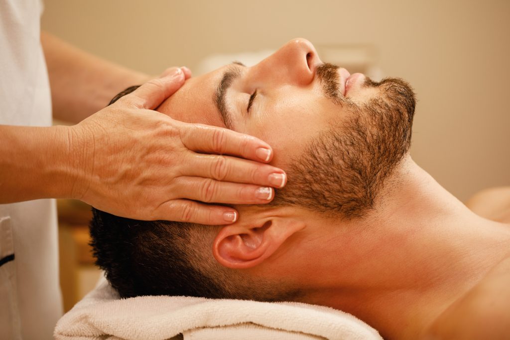 Massage Treatments 6 closeup man getting head massage relaxing with eyes closed spa - LondonMassage4U