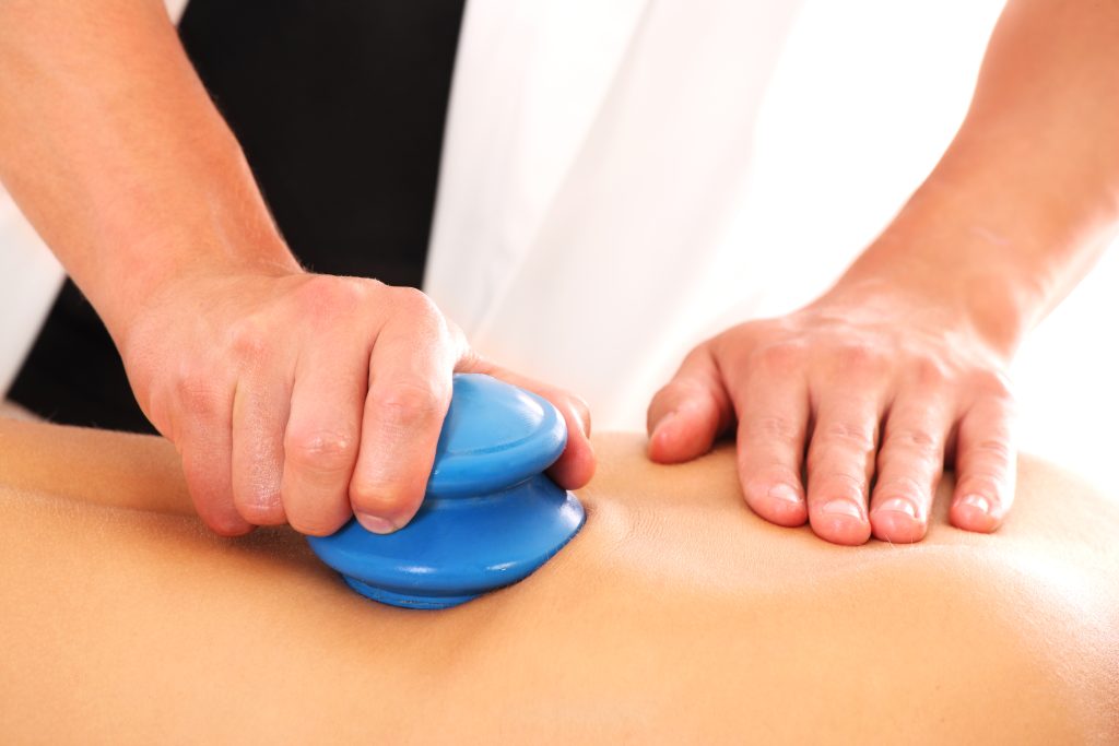Massage Treatments 1 male hands giving back massage white - LondonMassage4U